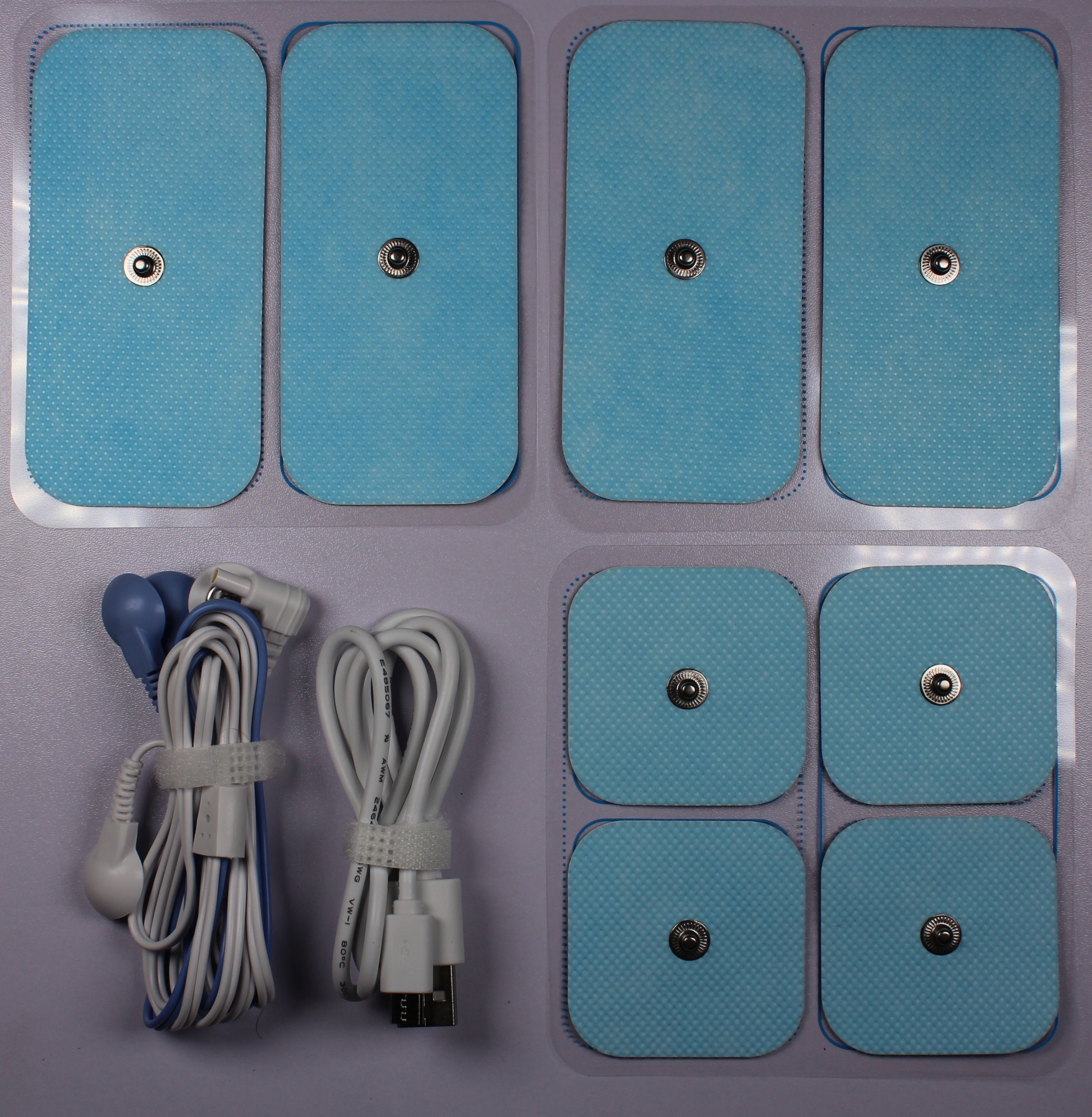 Lieferumfang - Zubehör: USB-A zu MikroUSB-Kabel, Elektrodenkabel, 4x Große Elektroden, 4x Kleine Elektroden, Beutel
